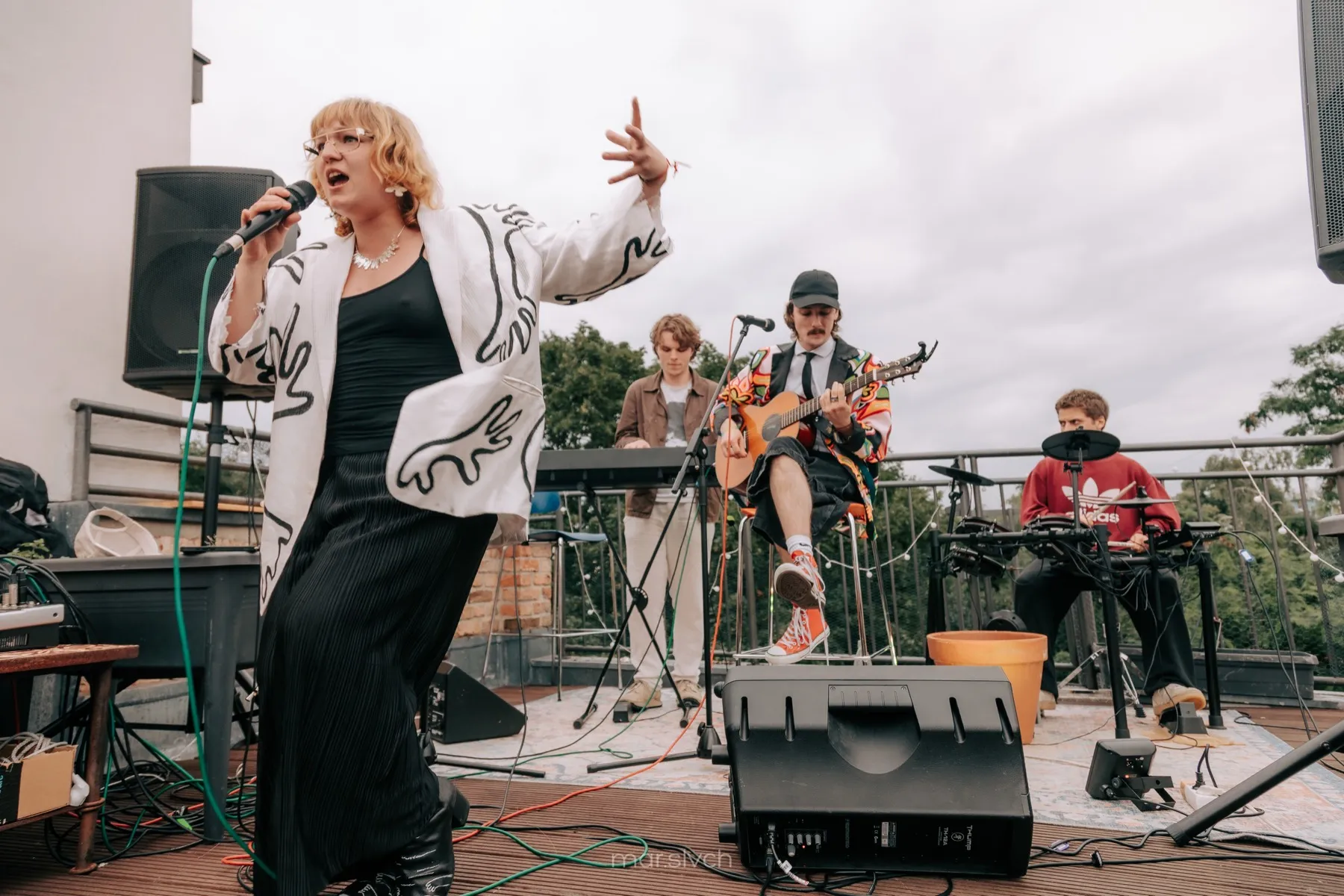 A band performs on a Berlin rooftop during the summer charity evening.
